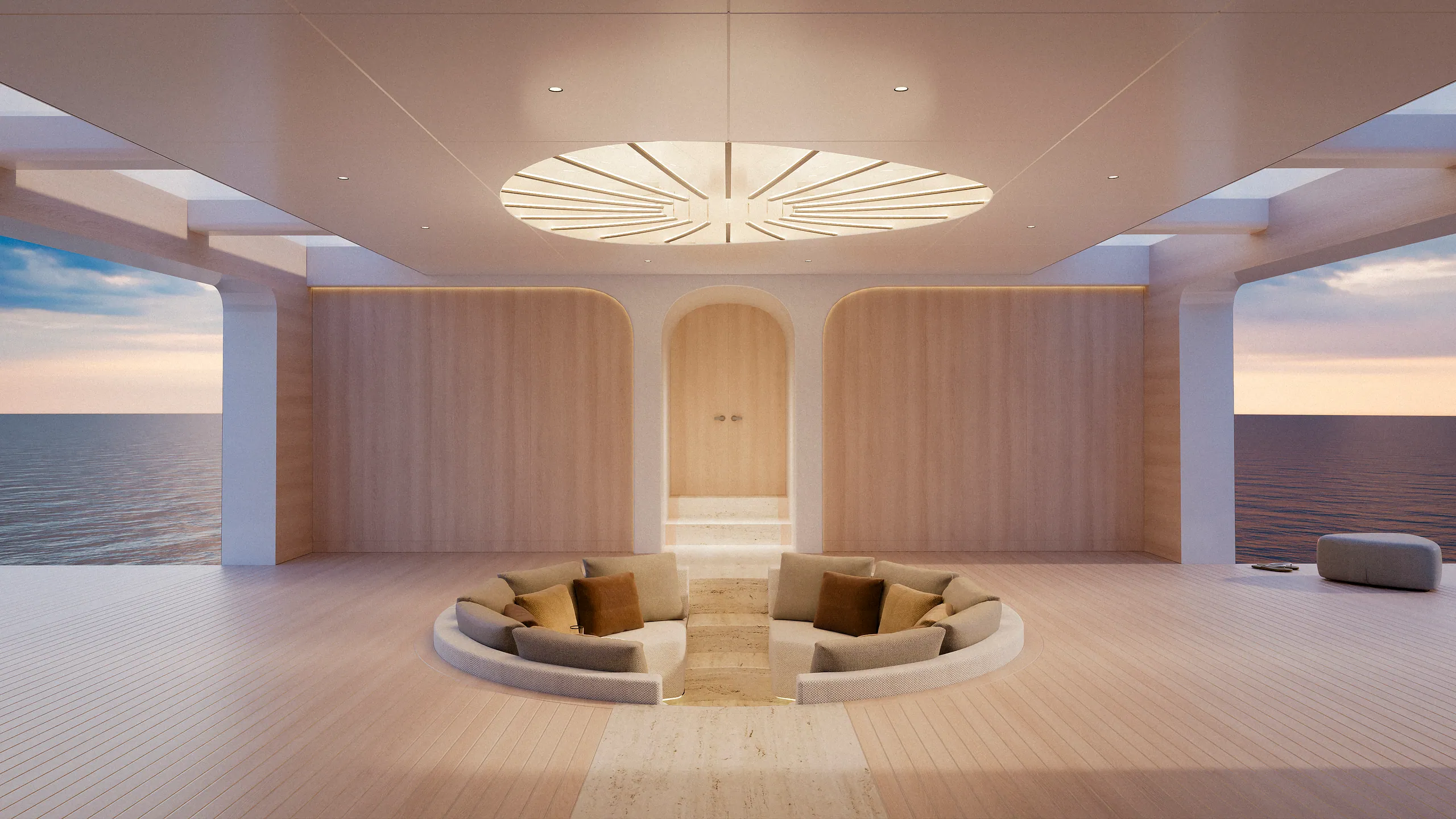 Atelier Cala yacht interior lounge — circular sofa beneath a radial ceiling light fixture, opening to the sea