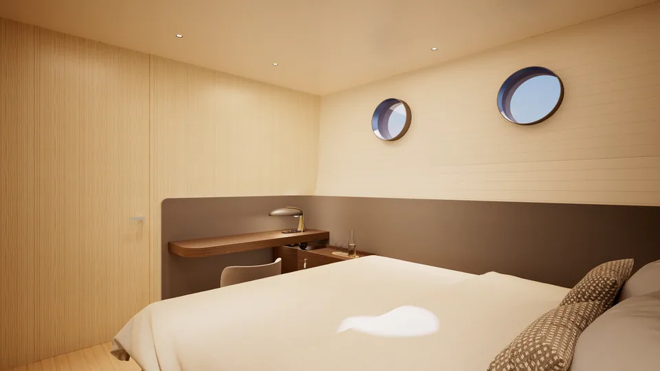 SailXplorer XV53 guest cabin — bed with bedside desk and reading light beneath twin portholes