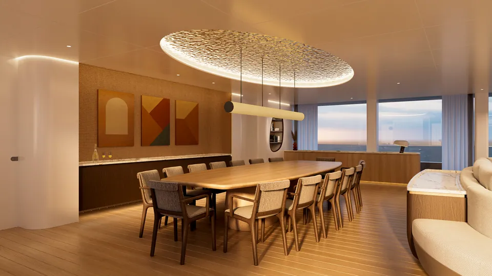 M/Y Waves dining area — long table beneath a sculptural pendant light