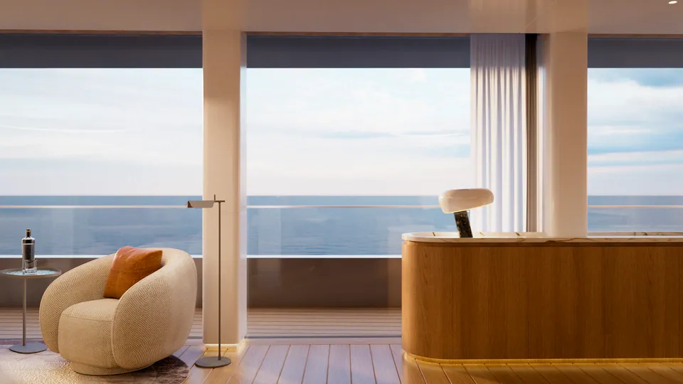 M/Y Waves saloon detail — armchair and side table beside floor-to-ceiling windows